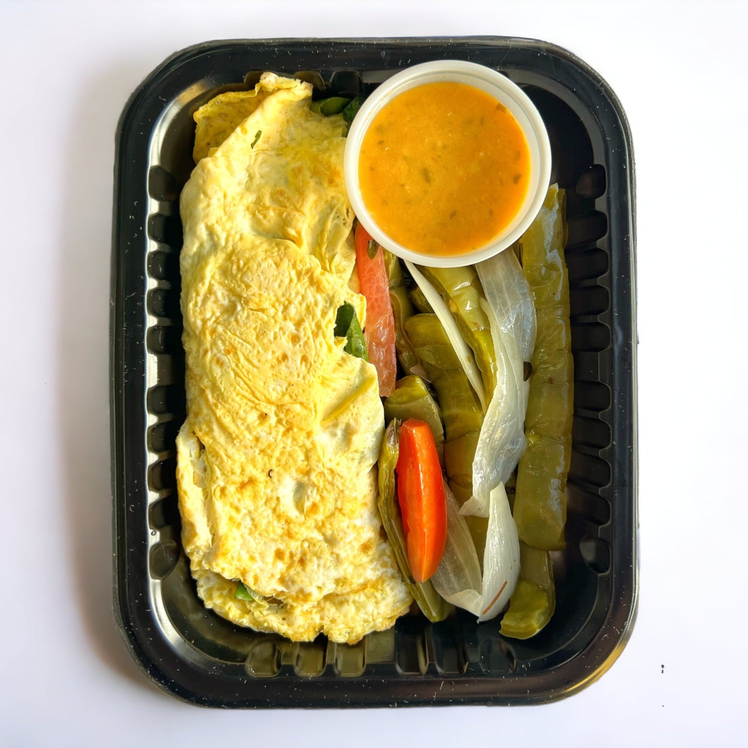 Omelette relleno de espinacas